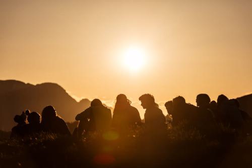 Group of Boy Scouts at sunset in the mountains